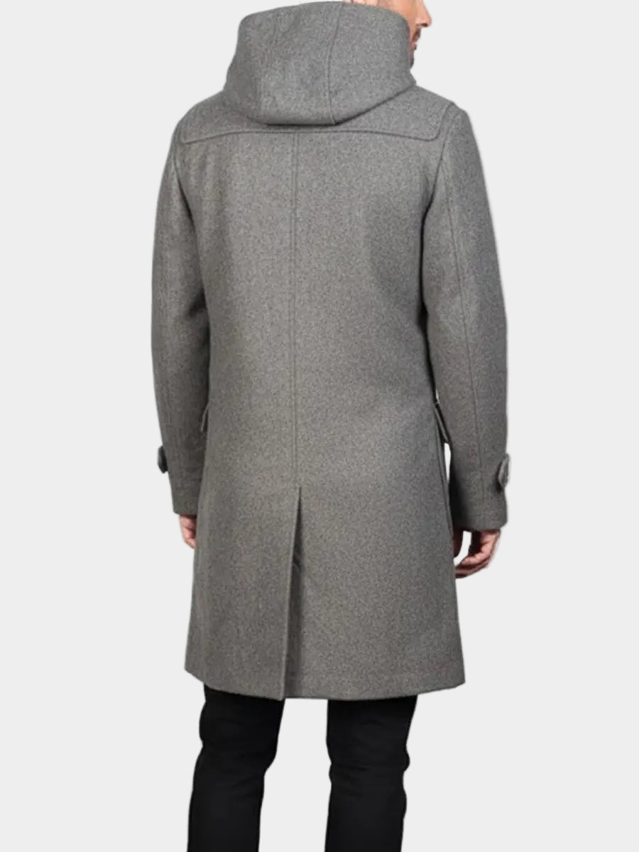 Gray coat worn by a person on a white background