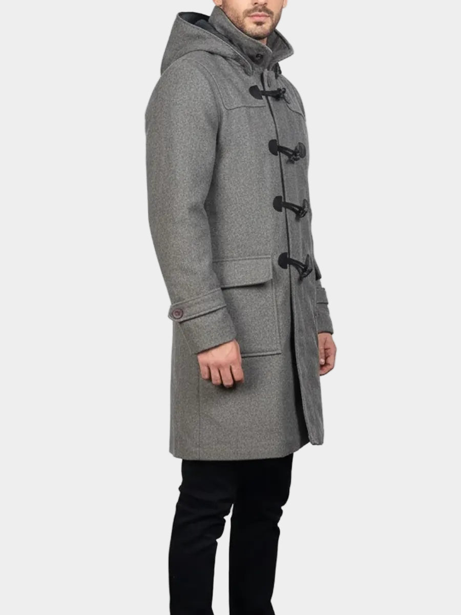 Man wearing a gray wool duffle coat on a white background