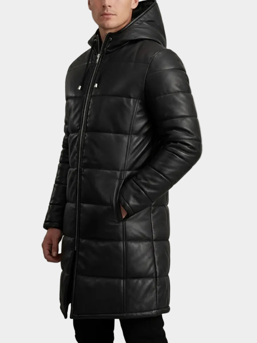 Man wearing a black puffer coat on a gray background