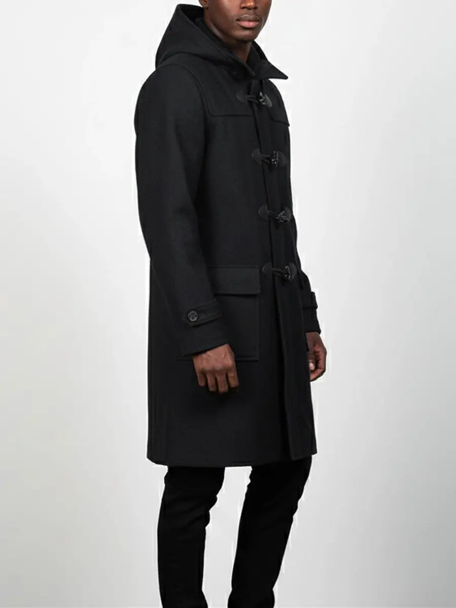 Man wearing a black coat on a white background