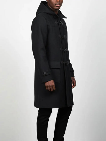 Man wearing a black coat on a white background