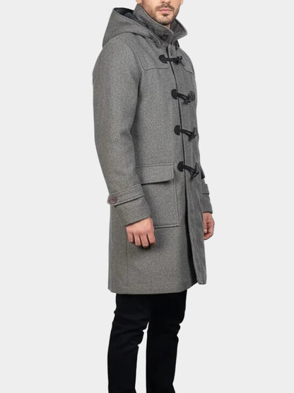 Man wearing a gray wool duffle coat on a white background