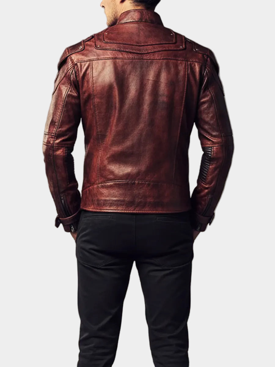 Man wearing a red leather jacket against a gray background