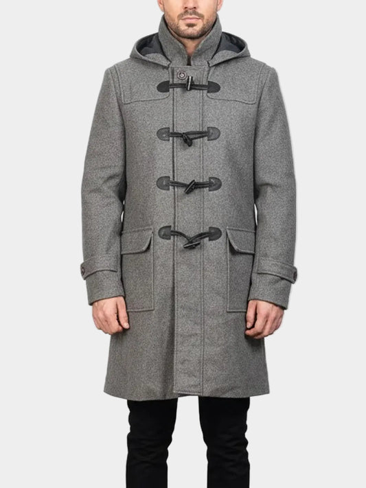 Man wearing a gray duffle coat with black buttons on a white background