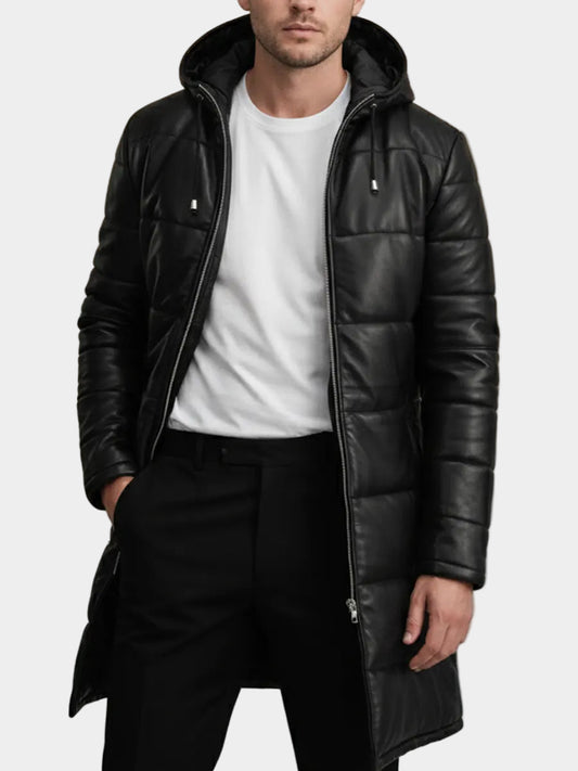 Man wearing a black leather coat with a hood on a neutral background