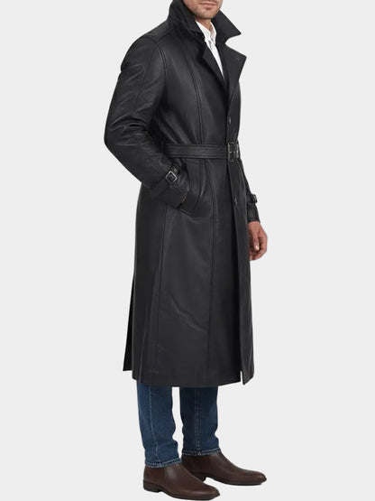 Man wearing a black trench coat on a white background